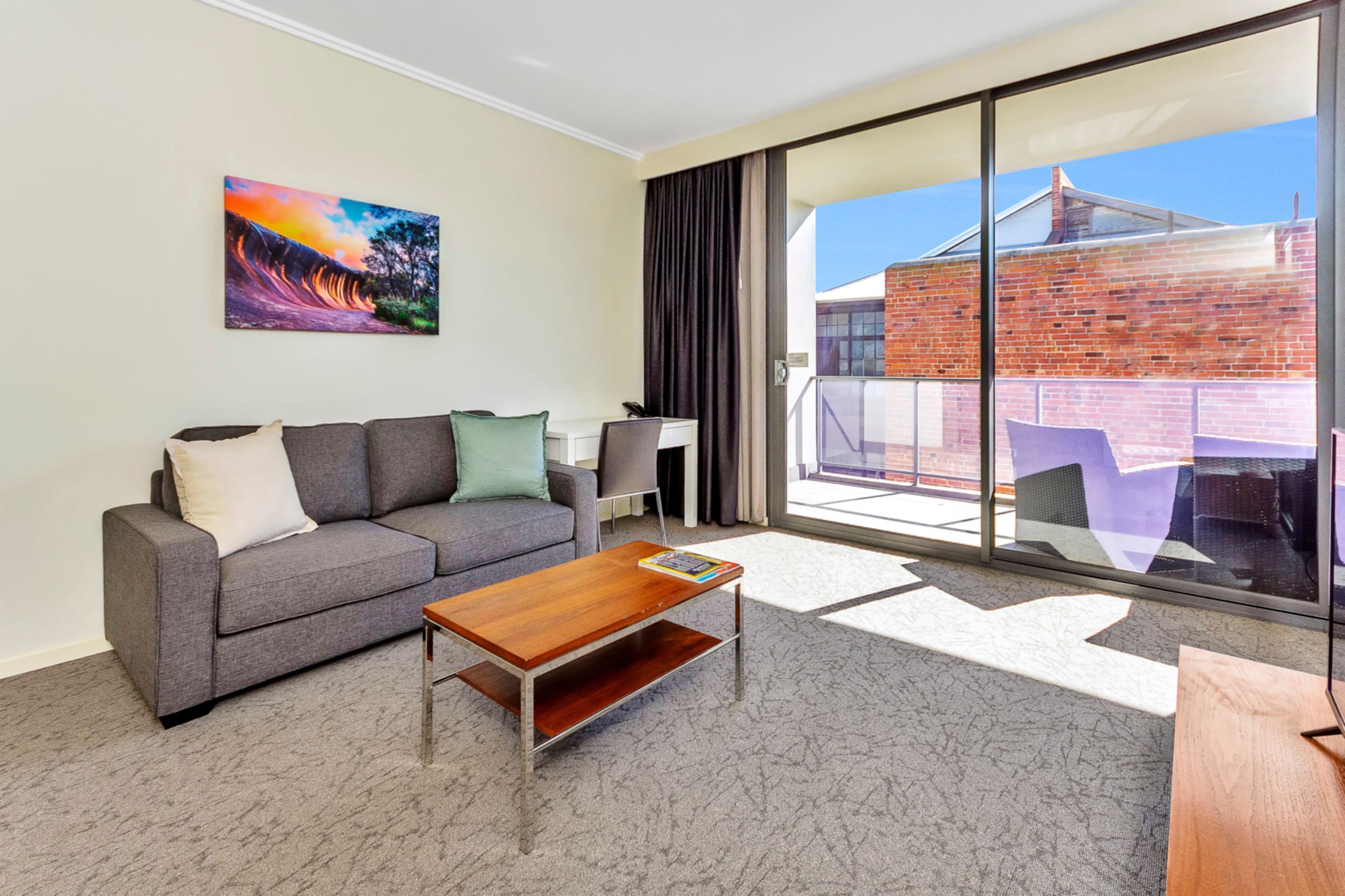 new haus suite with balcony | living area | 43-inch smart tv with digital channels, tv