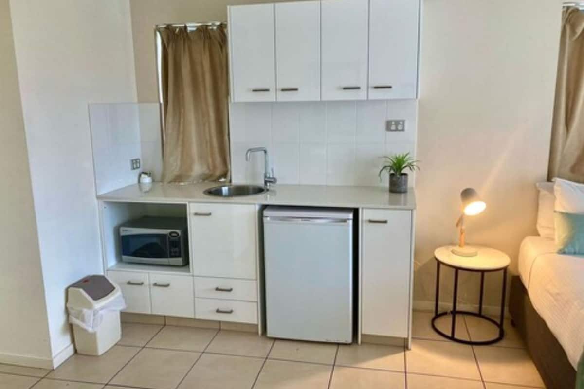 resort studio with kitchenette | private kitchen | electric kettle, dining tables