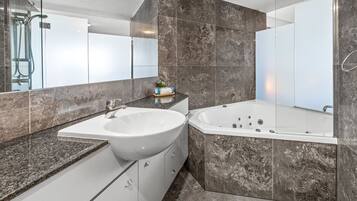 Luxury One Bedroom Ocean View Apartment with Spa Bath | Bathroom | Free toiletries, hair dryer, towels, soap