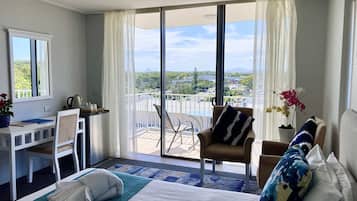 Resort Studio | Living area | 30-inch TV with cable channels