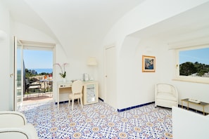 Junior Suite, Balcony, Sea View | Minibar, in-room safe, desk, rollaway beds