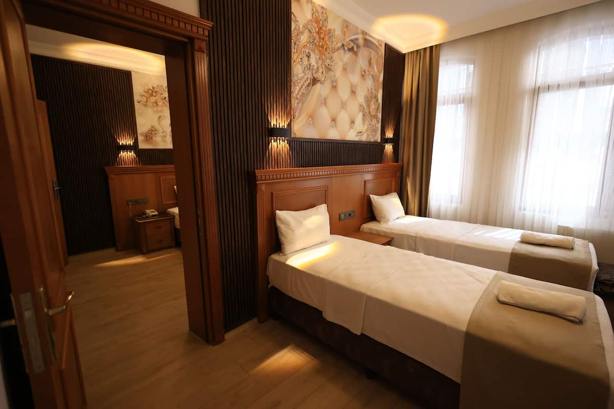 Family Quadruple Room | 1 bedroom, minibar, desk, blackout curtains
