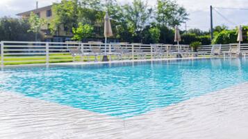 2 outdoor pools, a rooftop pool, pool umbrellas, pool loungers