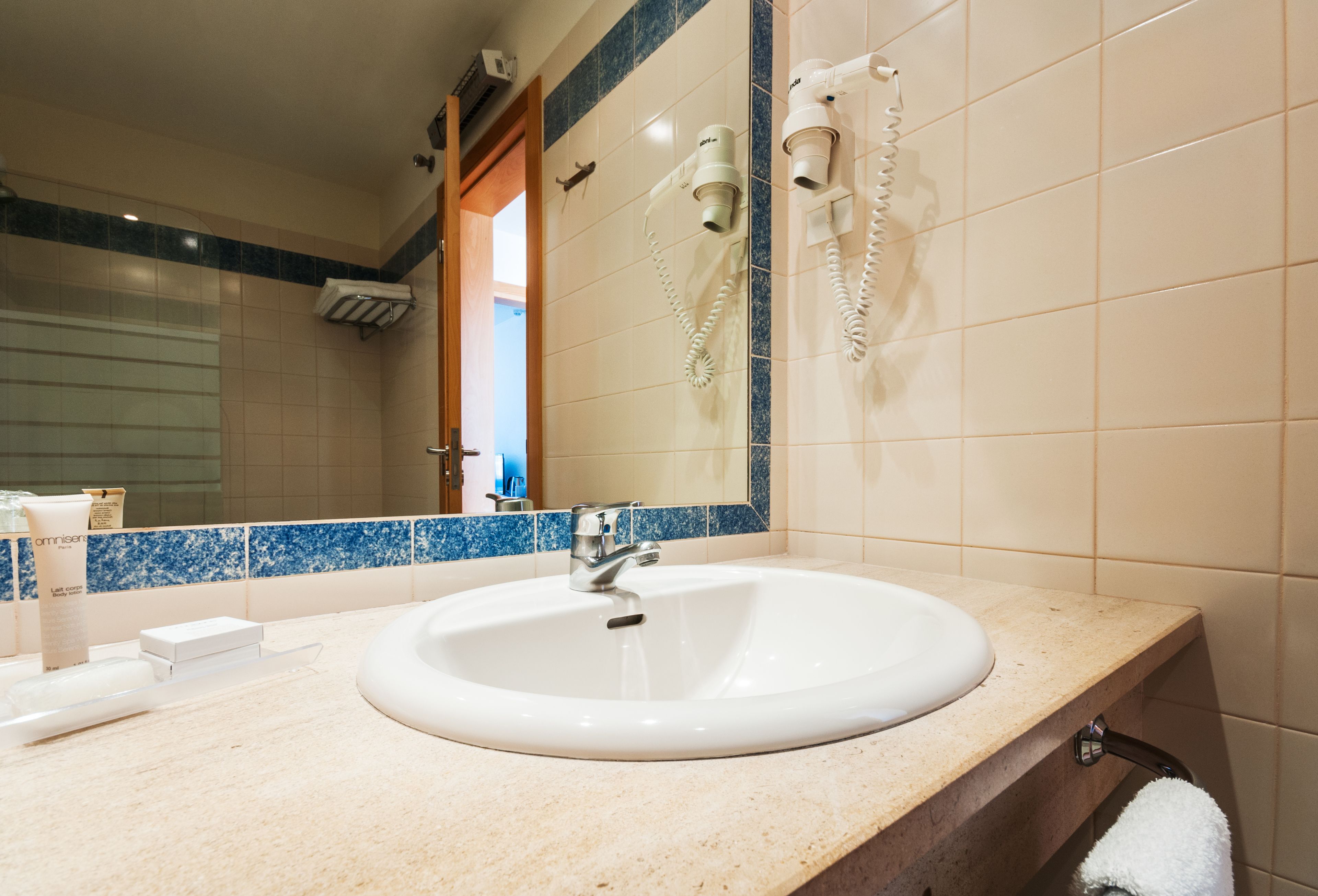 eco-friendly toiletries, hair dryer, towels, soap