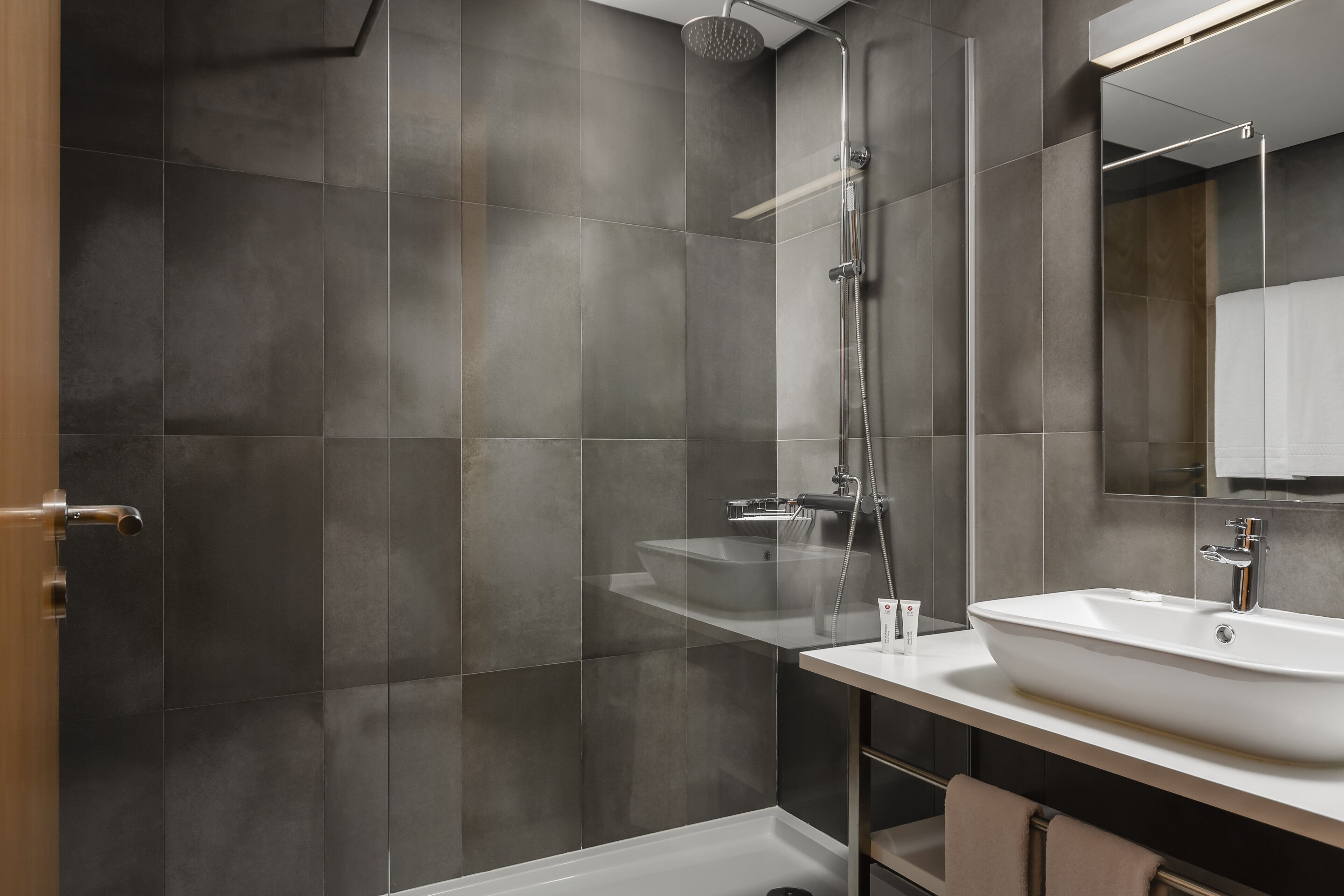 eco-friendly toiletries, hair dryer, towels, soap