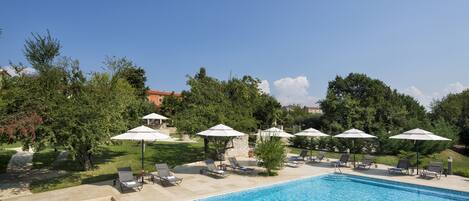 Indoor pool, outdoor pool, pool umbrellas, pool loungers