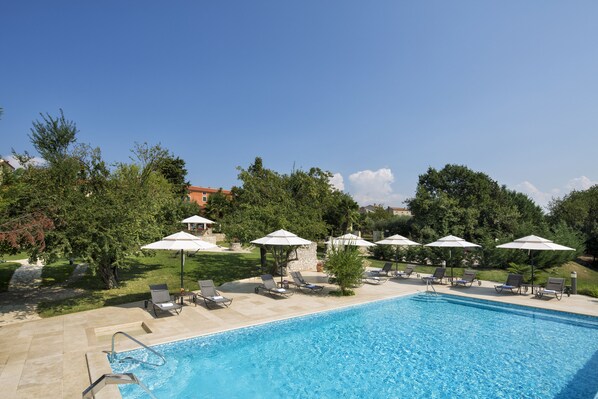 Indoor pool, outdoor pool, pool umbrellas, pool loungers