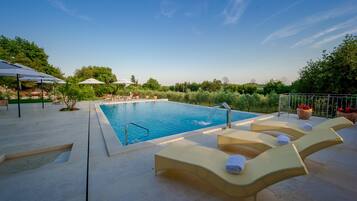 Indoor pool, outdoor pool, pool umbrellas, sun loungers