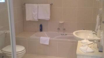 Separate tub and shower, deep soaking tub, hair dryer, towels