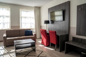 Habitación Deluxe | Colchones Select Comfort, cortinas opacas, wifi gratis y ropa de cama