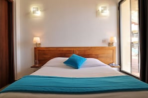 Apartment, 2 Bedrooms, Balcony, Sea View | Cribs/infant beds, bed sheets