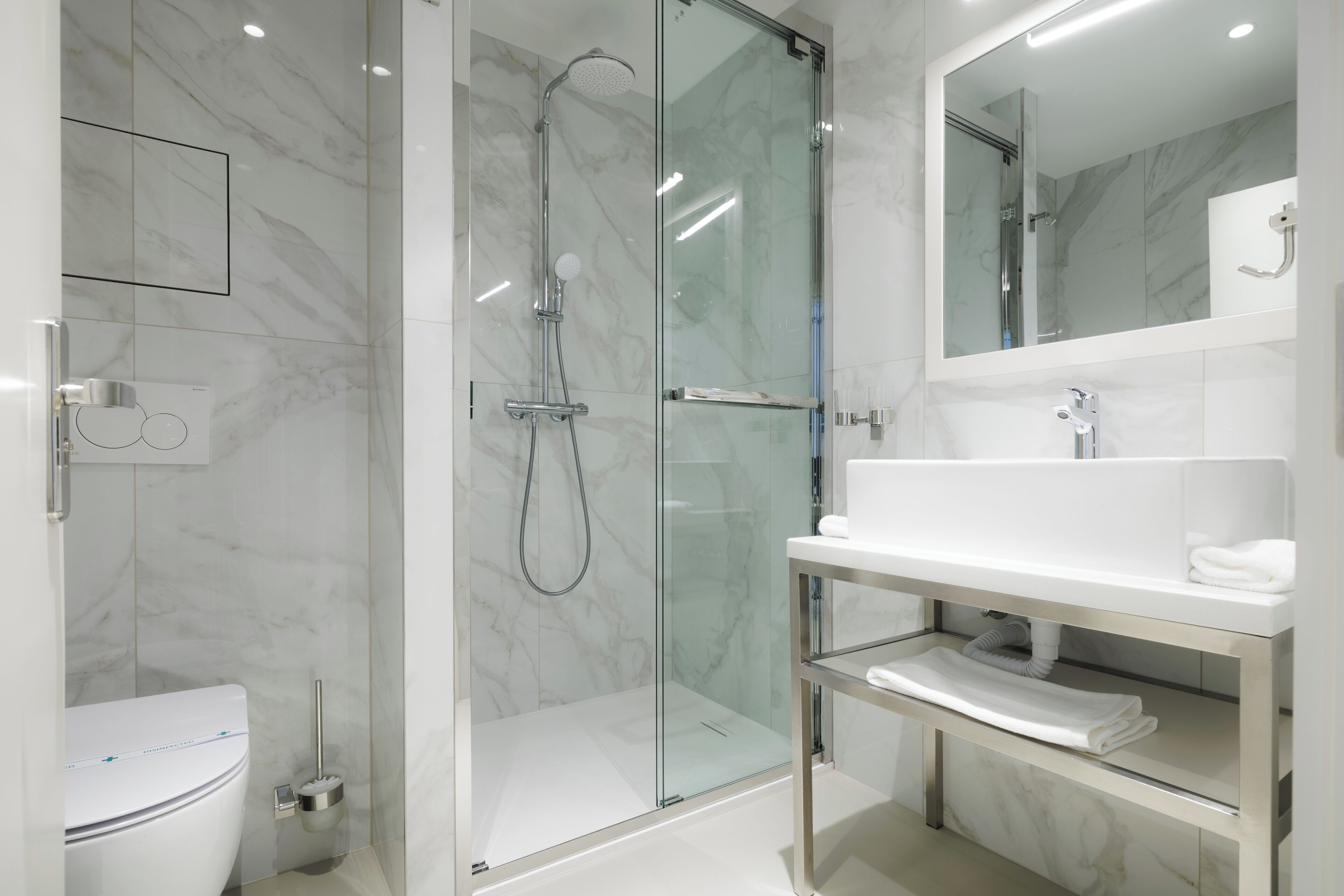 shower, hair dryer, slippers, towels