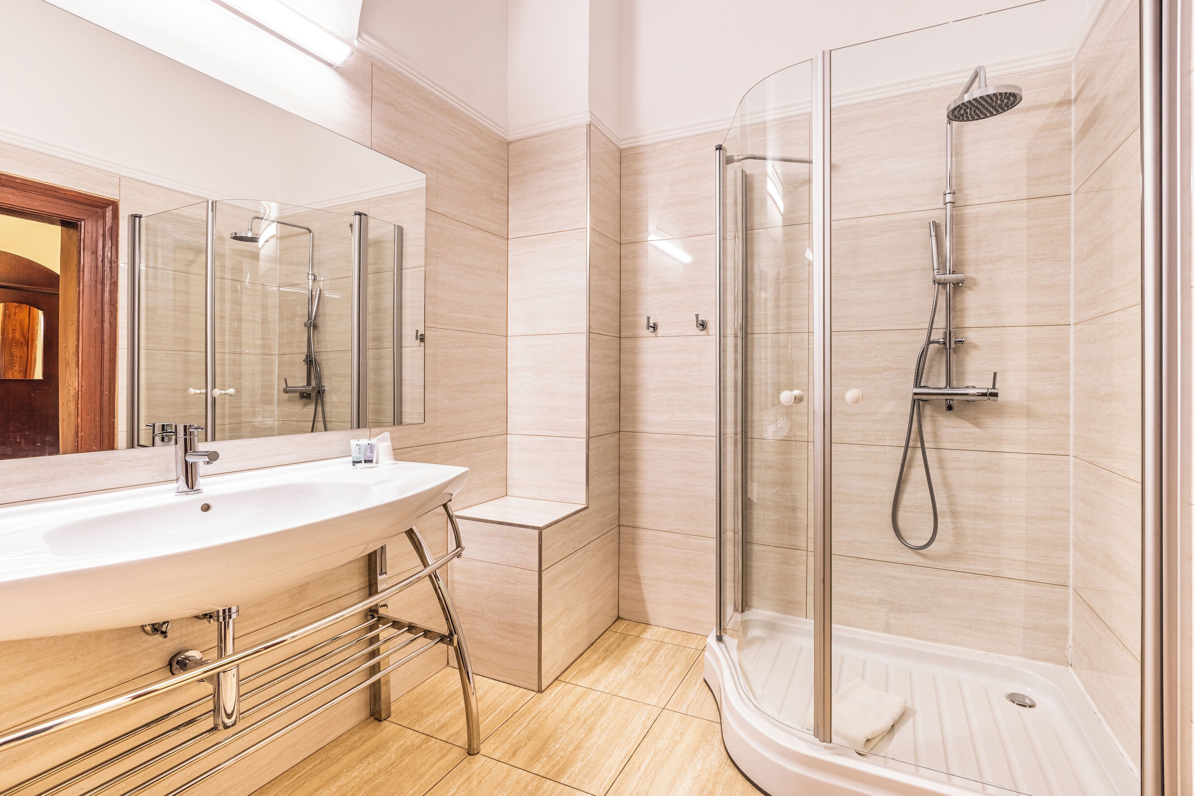 junior suite | bathroom | shower, hair dryer, slippers, towels