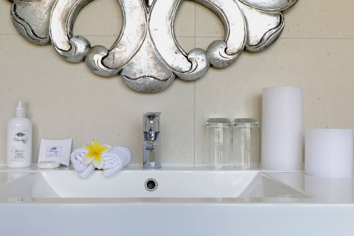 rainfall showerhead, designer toiletries, hair dryer, towels