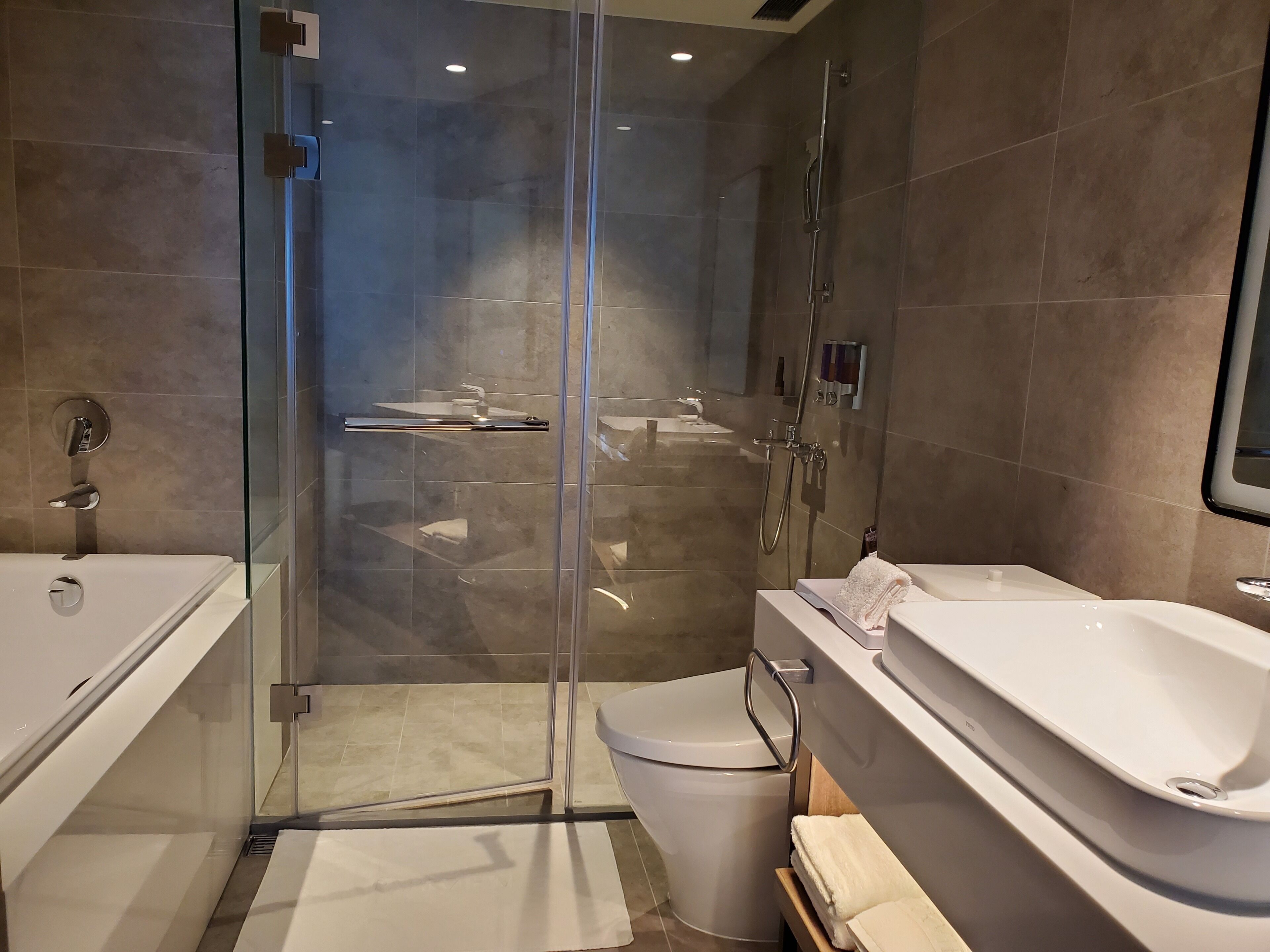 deluxe twin room with bathtub | bathroom | hair dryer, bidet, towels