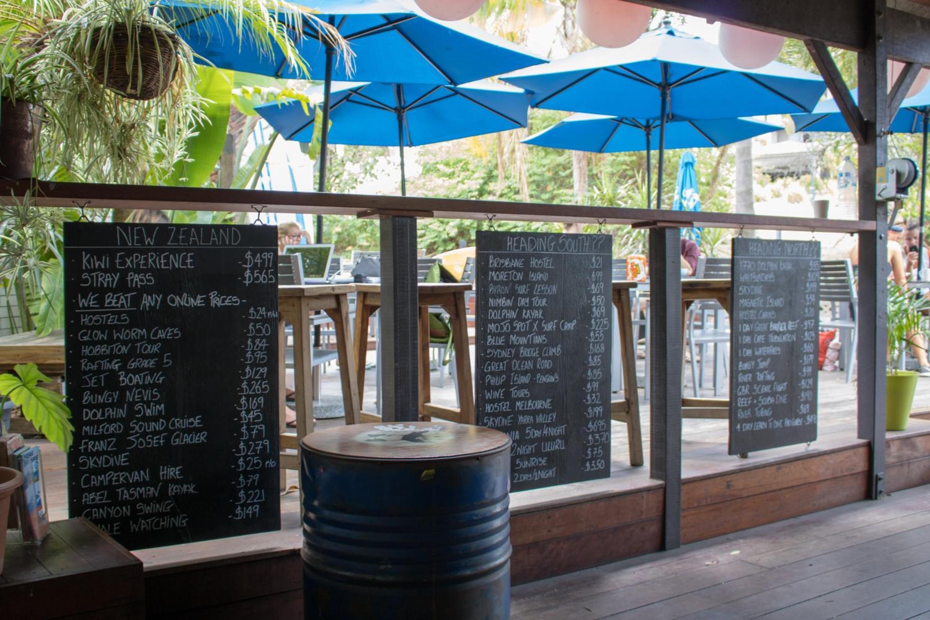A menu board with various food and drink options and prices.