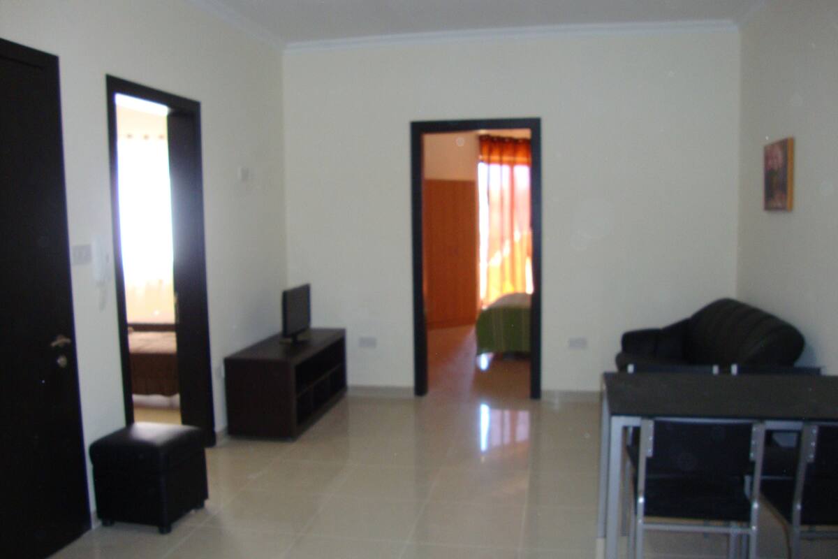 Standard Apartment, 2 Bedrooms | Living area | 32-inch flat-screen TV with cable channels, TV