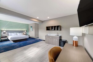 Desk, laptop workspace, blackout drapes, iron/ironing board