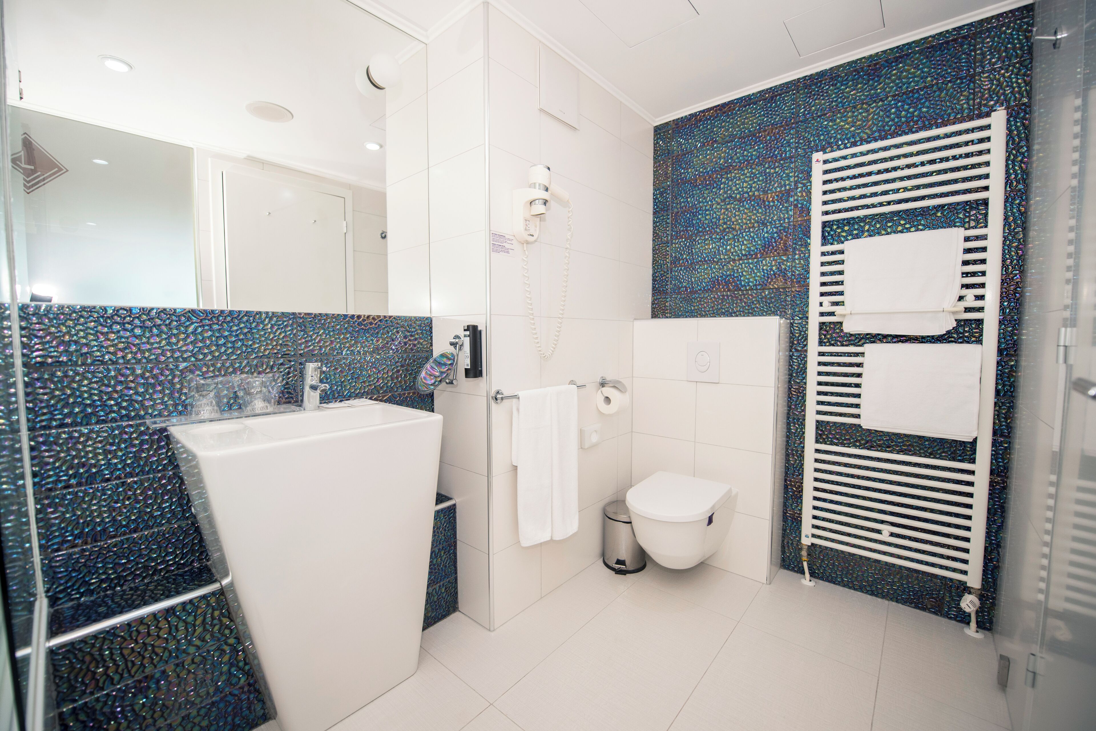 deluxe suite, balcony, sea view | bathroom | designer toiletries, hair dryer, bathrobes, slippers