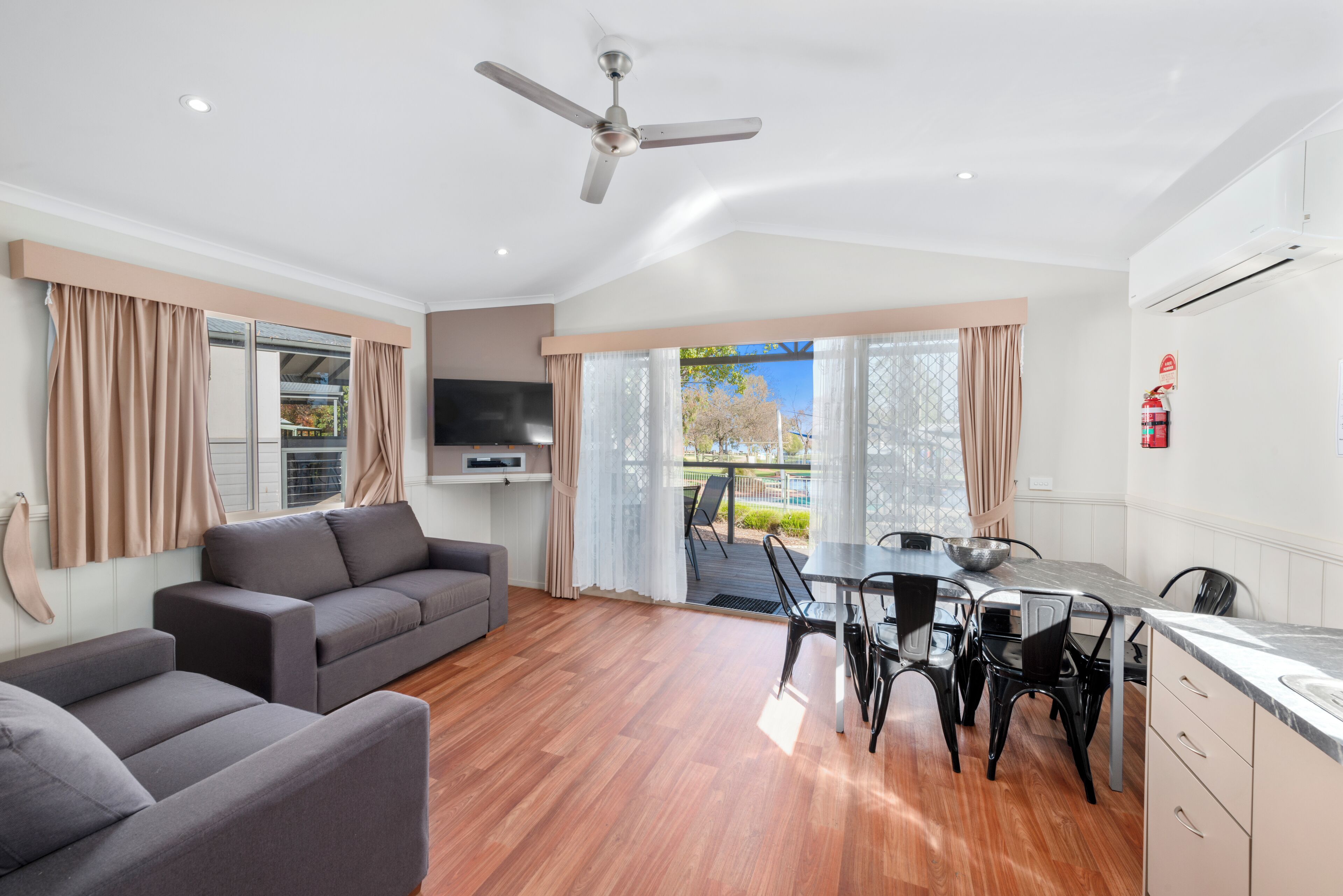 Poolside Villa - 2 Bedroom Sleeps 6 | Living area | Flat-screen TV, ping pong, books, video library