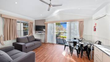 Poolside Villa - 2 Bedroom Sleeps 6 | Living area | Flat-screen TV, table tennis, books, video library