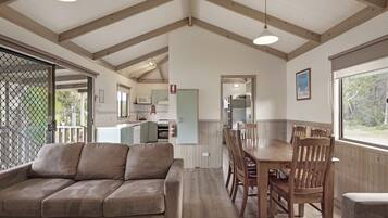 Deluxe 2 Bedroom Cabin | Living room | Flat-screen TV, DVD player