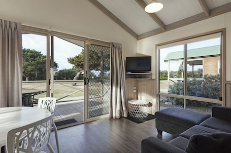 Superior 2 Bedroom Cabin - Sleeps 5 | Living area | Flat-screen TV, DVD player