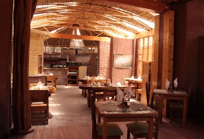 Breakfast, lunch, dinner served; international cuisine, pool views  - Hotel Kimal (San Pedro de Atacama)