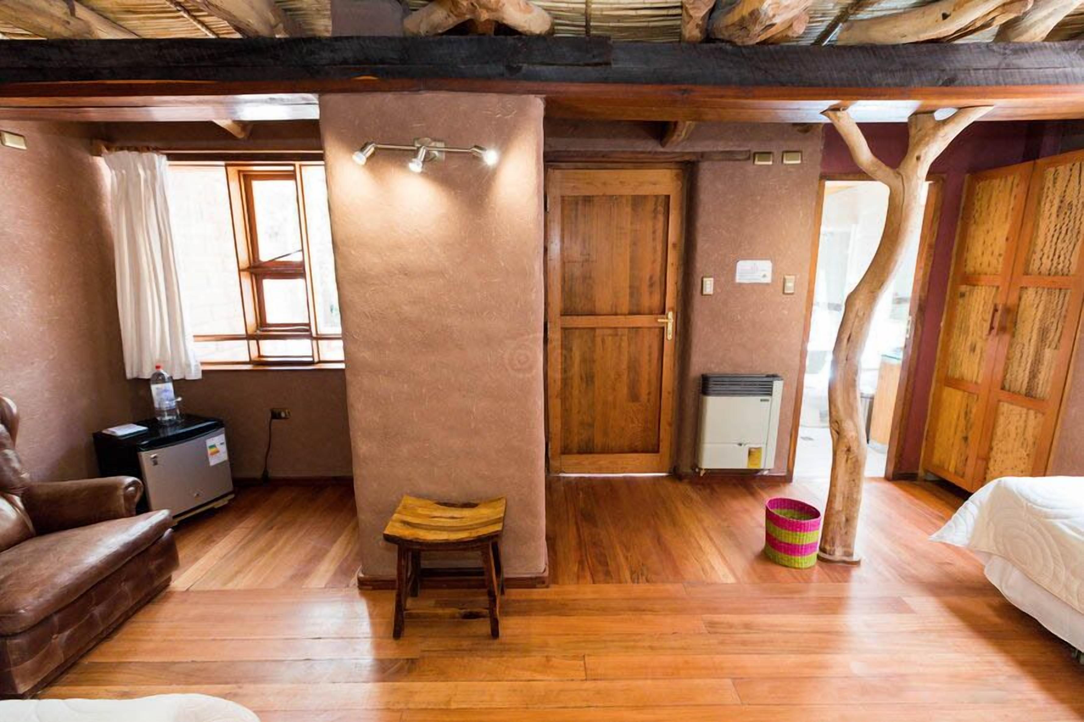 family room | 1 bedroom, minibar, in-room safe, individually decorated