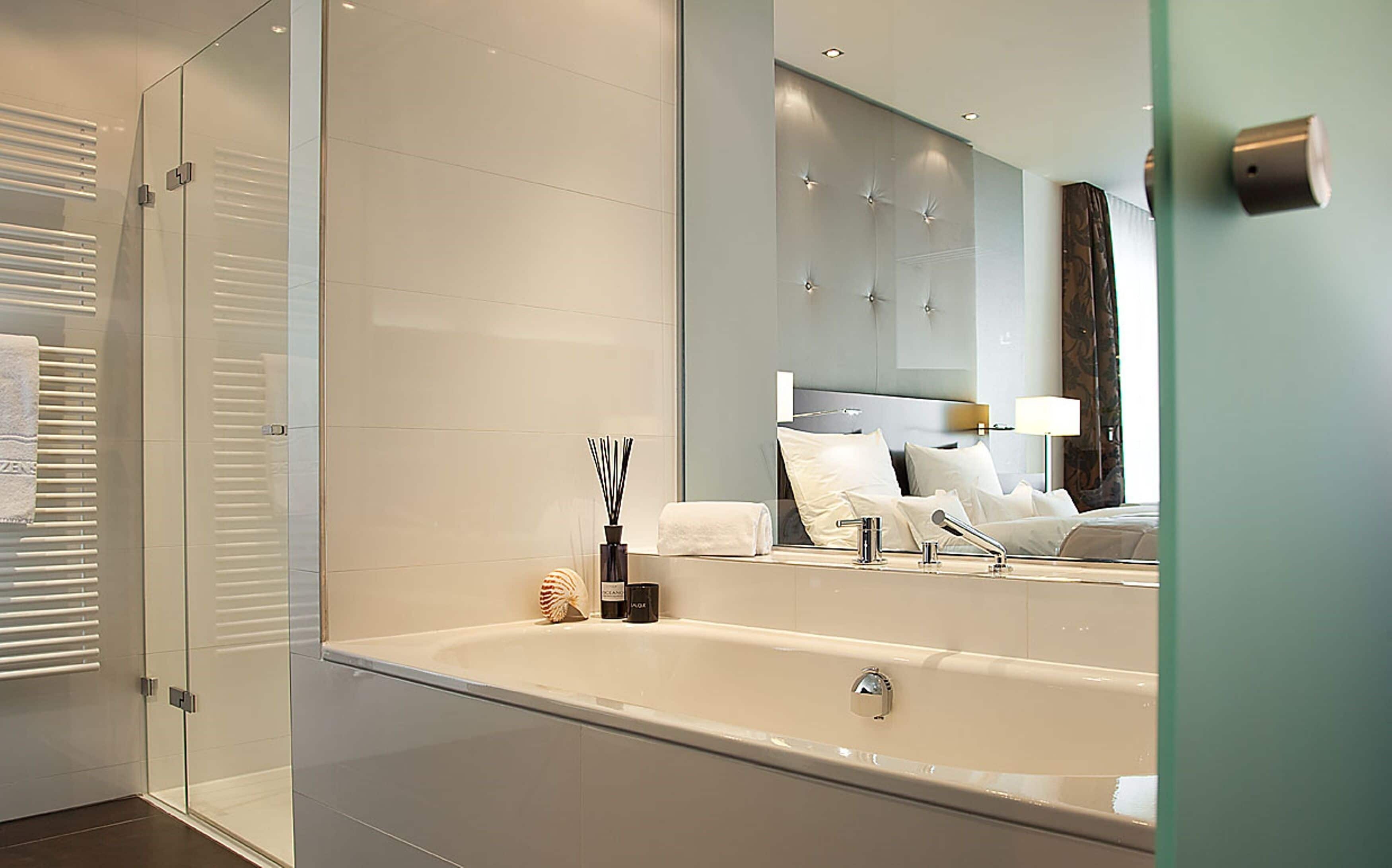 designer toiletries, hair dryer, bathrobes, slippers