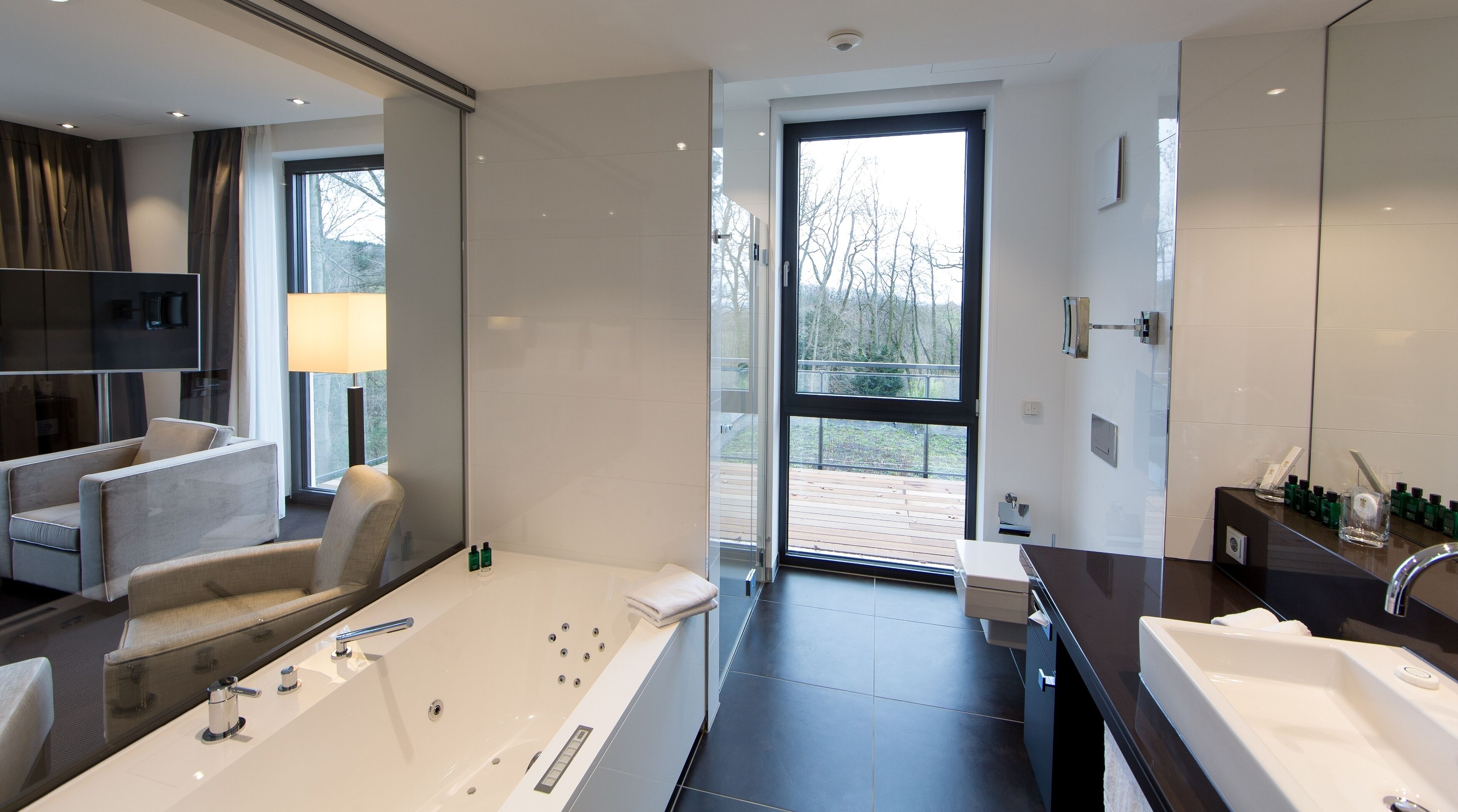 designer toiletries, hair dryer, bathrobes, slippers