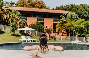 Seasonal outdoor pool, open 8:00 AM to 9 PM, pool umbrellas