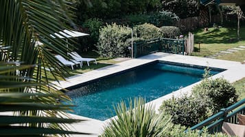 Seasonal outdoor pool, open 8:00 AM to 9 PM, pool umbrellas