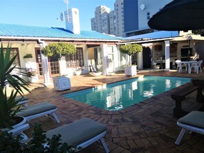 Outdoor pool, open 10:30 AM to 6:30 PM, pool umbrellas, pool loungers