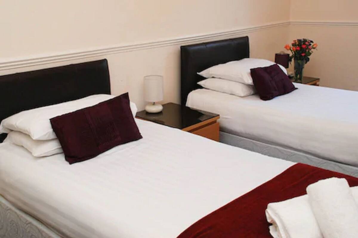 twin room | desk, iron/ironing board, bed sheets