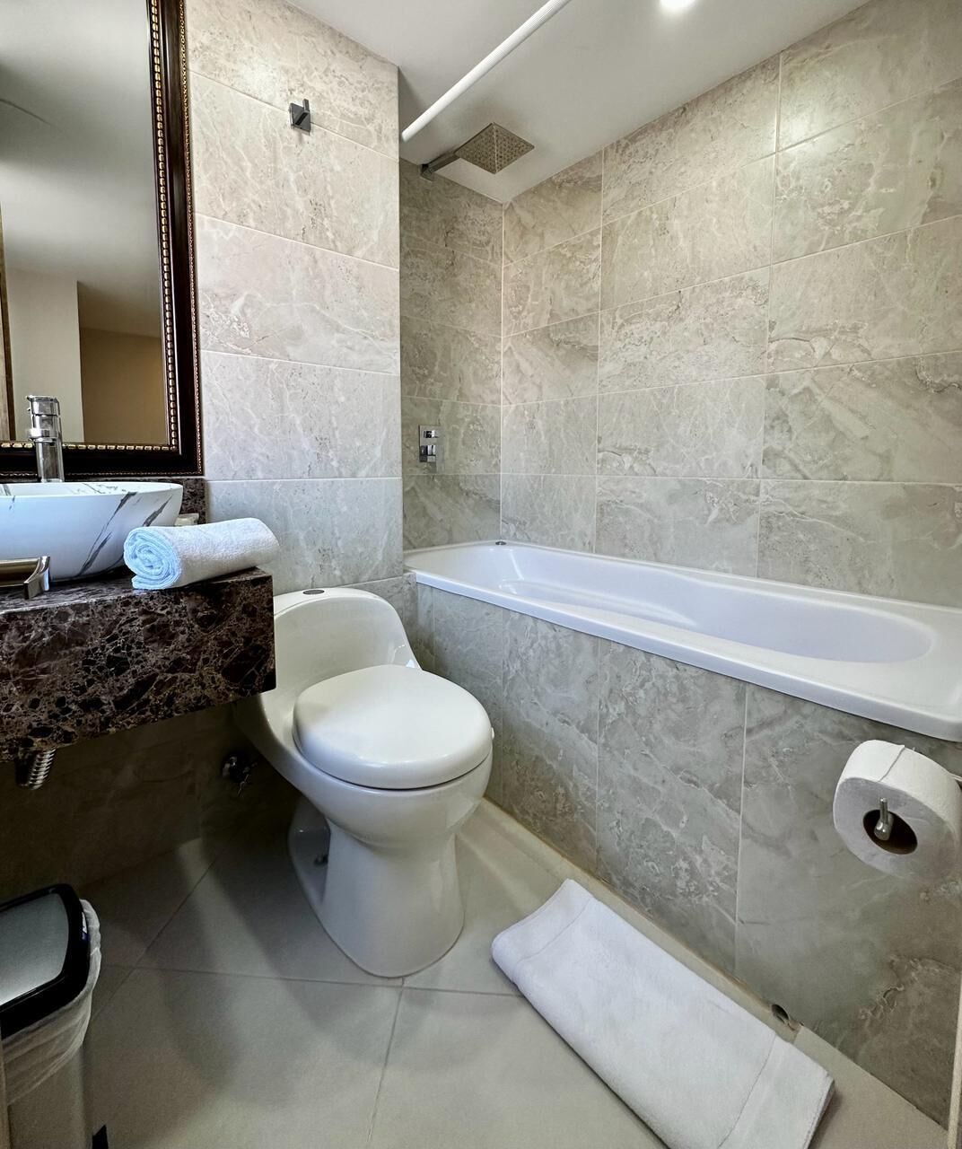 family apartment, bathtub | bathroom | towels, soap, shampoo, toilet paper