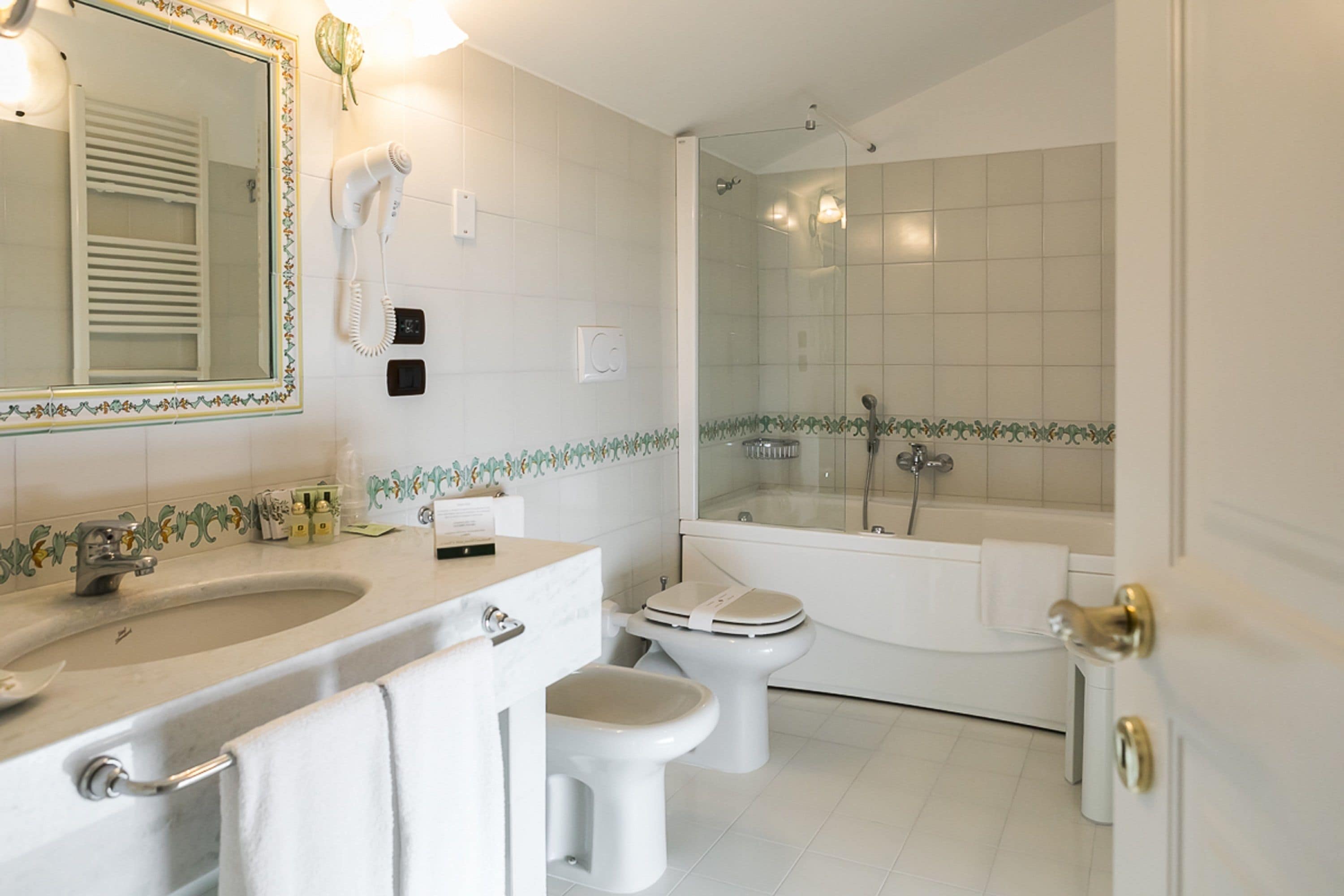 deluxe double room (spa access) | bathroom | free toiletries, hair dryer, slippers, bidet