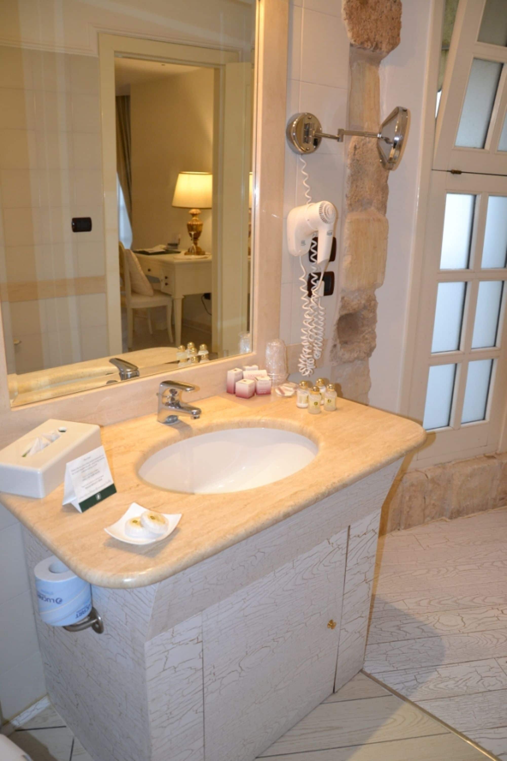 sangiorgio suite (spa access) | bathroom | free toiletries, hair dryer, slippers, bidet