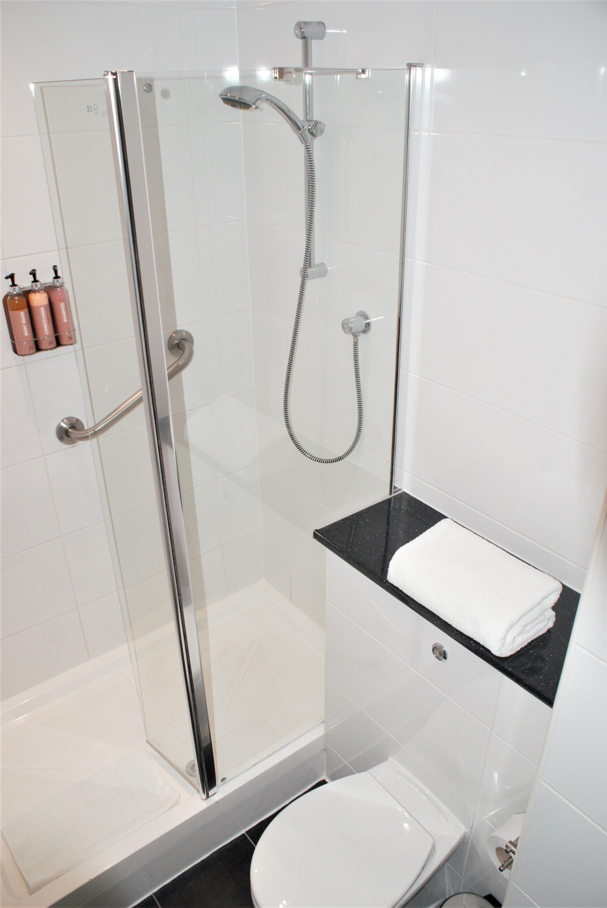 superior quadruple room | bathroom | shower, free toiletries, hair dryer, towels