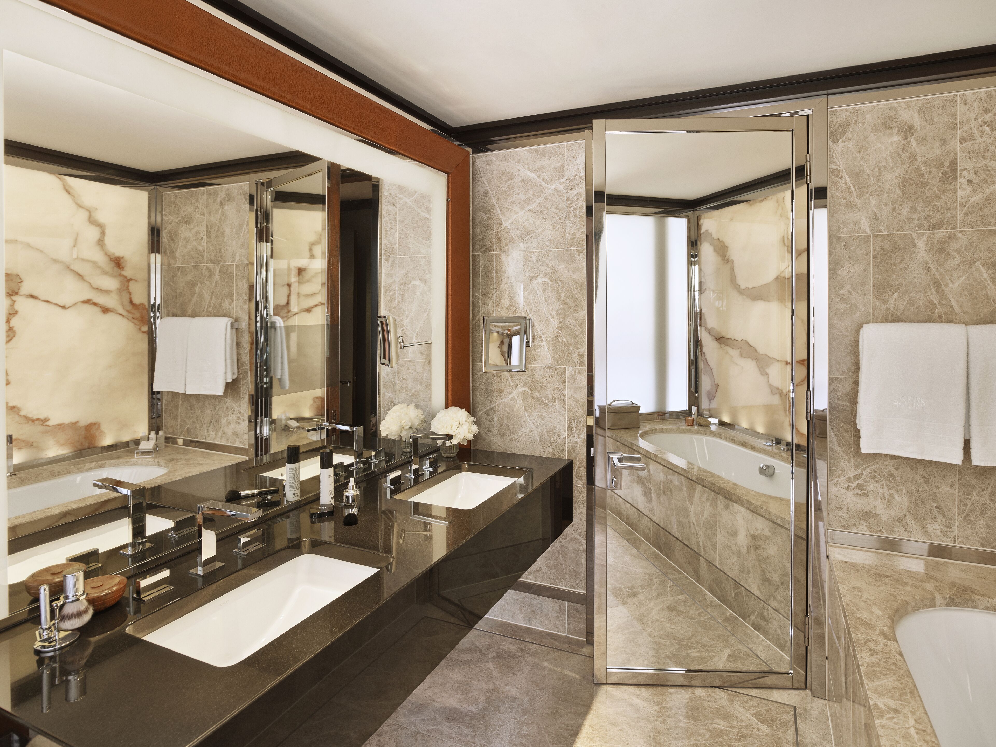 separate bathtub and shower, rainfall showerhead, designer toiletries