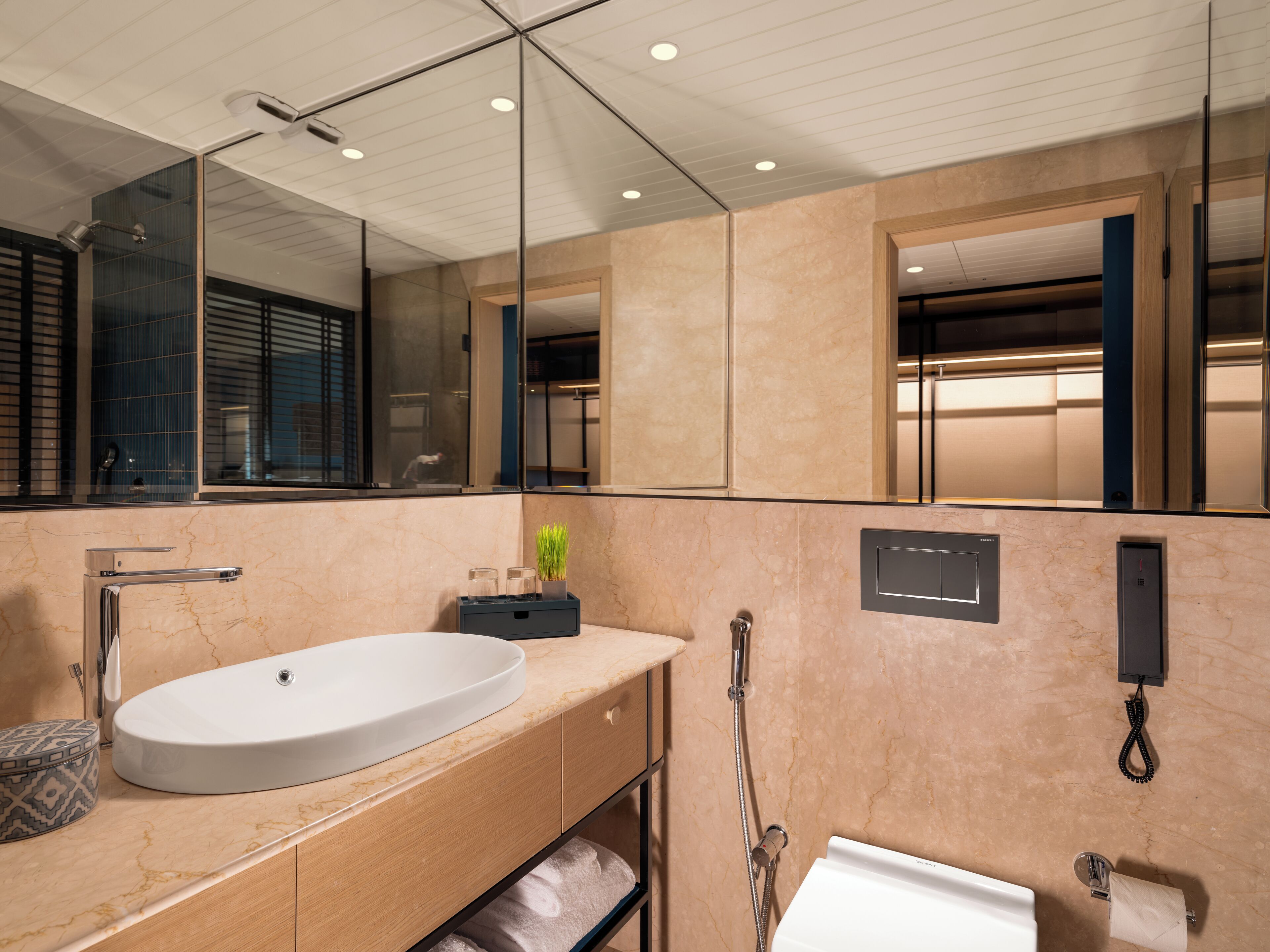 deluxe suite, 1 king bed | bathroom | designer toiletries, hair dryer, bathrobes, slippers