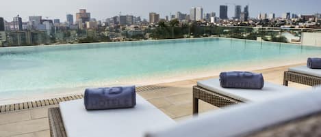 Outdoor pool, pool umbrellas, sun loungers