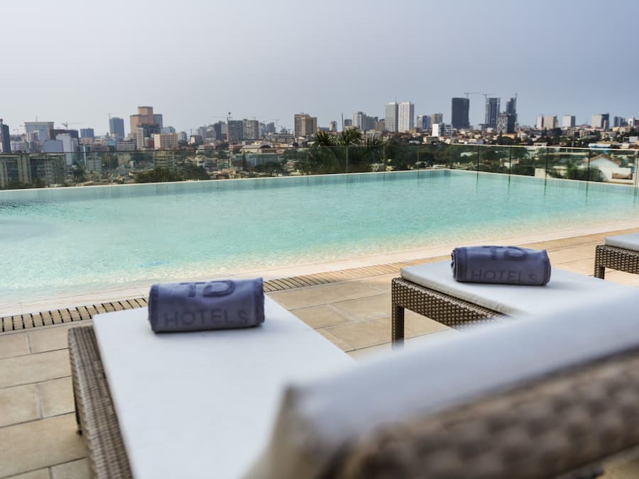 Outdoor pool, pool umbrellas, sun loungers