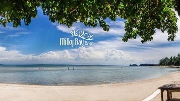 Private beach, white sand, sun loungers, beach umbrellas