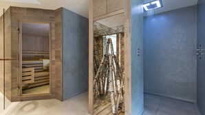A modern bathroom with a glass shower enclosure, a wooden vanity, and a visible toilet.