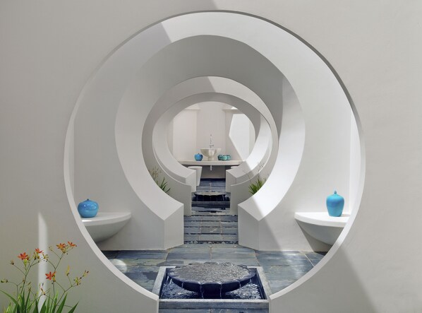 A circular architectural design with a central water feature and a sink area. - SO/ Sofitel Mauritius (Bel Ombre)
