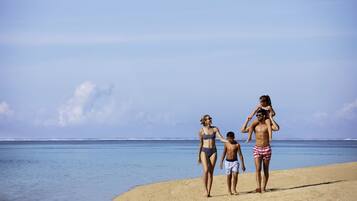 On the beach, white sand, free beach cabanas, sun-loungers