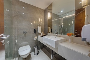Studio Suite | Bathroom | Shower, free toiletries, hair dryer, slippers - Hotel Suba International (Mumbai)