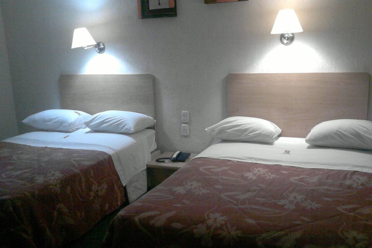 Standard Double Room, 2 Double Beds | Pillowtop beds, in-room safe, blackout drapes