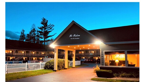 A two-story building with a covered entrance and a sign reading "Mt. Madison Inn & Suites". - Mt Madison Inn & Suites (Gorham)